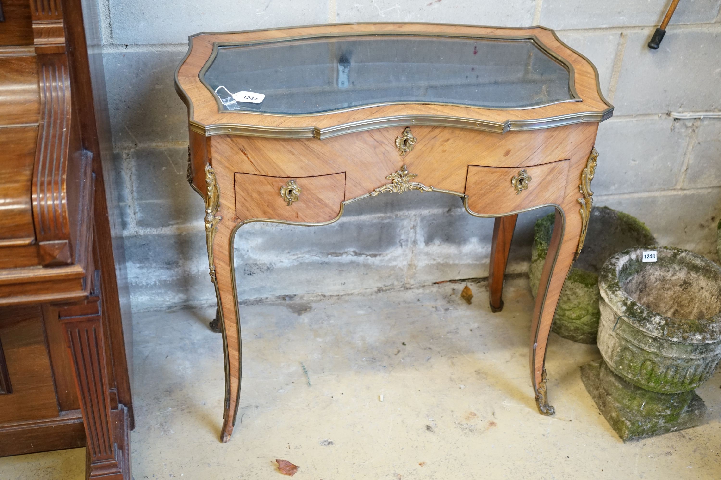 A reproduction kidney shaped French kingwood vitrine, width 79cm, depth 45cm, height 76cm